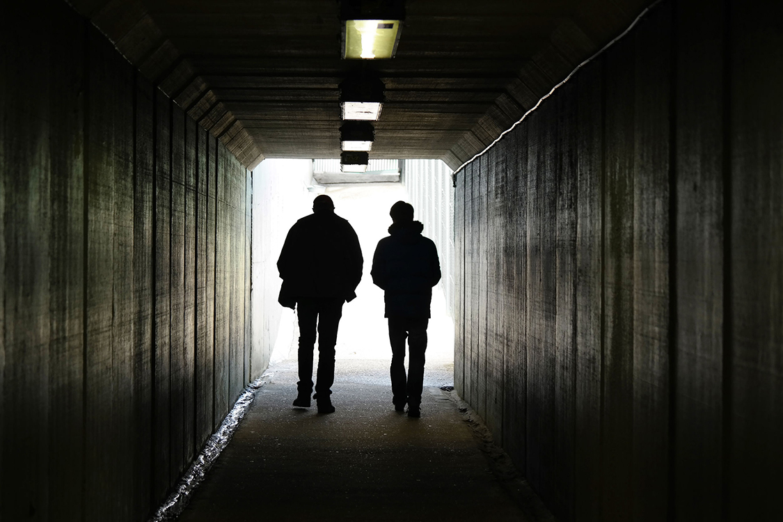 Four tips for those helping people in grief Silhouette Man Walking Tunnel